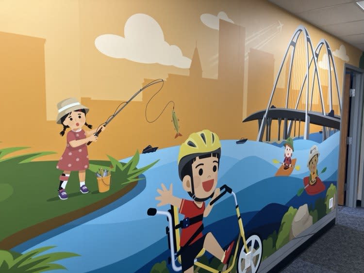 A QC-themed kids mural in the new Davenport clinic.