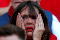 Soccer Football - Liverpool fans watch the Champions League Final - Liverpool, Britain - May 26, 2018 Liverpool fan inside Anfield reacts after Mohamed Salah sustains an injury REUTERS/Andrew Yates