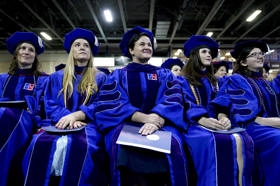 Graduating members of the American University's Washington College of Law listen as Supreme Court Associate Justice Ketanji Brown Jackson is introduced during a commencement ceremony, Saturday, May 20, 2023, in Washington. (AP Photo/Patrick Semansky)