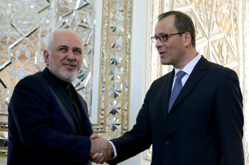 Iranian Foreign Minister Mohammad Javad Zarif (left) welcomes Cornel Feruta, acting head of the UN atomic watchdog, upon his arrival in Tehran in September 2019