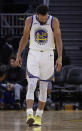 Golden State Warriors' Stephen Curry looks at his left hand after Phoenix Suns' Aron Baynes fell onto him during the second half of an NBA basketball game Wednesday, Oct. 30, 2019, in San Francisco. Curry left the game. (AP Photo/Ben Margot)