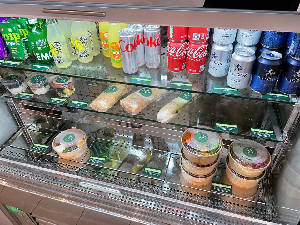 Picture of fridge in Clean Kitchen Club, containing coke, diet coke and lemonade.