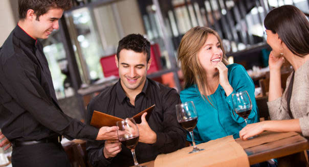 Group of friends having dinner at a restaurant