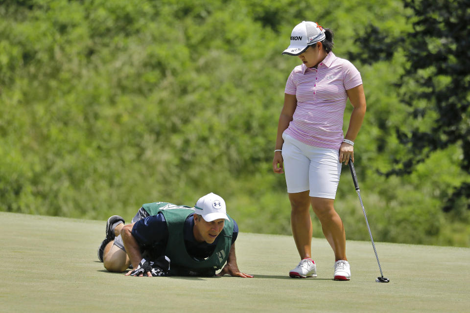 Nasa Hataoka watches as her caddie surveys the green on the seventh hole during the second round of the LPGA Tour golf tournament at Kingsmill Resort, Friday, May 24, 2019, in Williamsburg, Va. (Jonathon Gruenke/The Daily Press via AP)