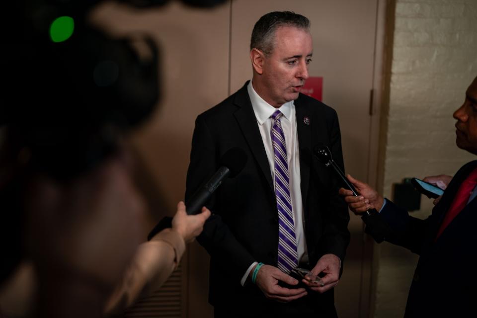 Rep. Brian Fitzpatrick, R-Pa., chats with reporters while arriving for a House Republican conference meeting on Capitol Hill on March, 6 2024 in Washington, DC.