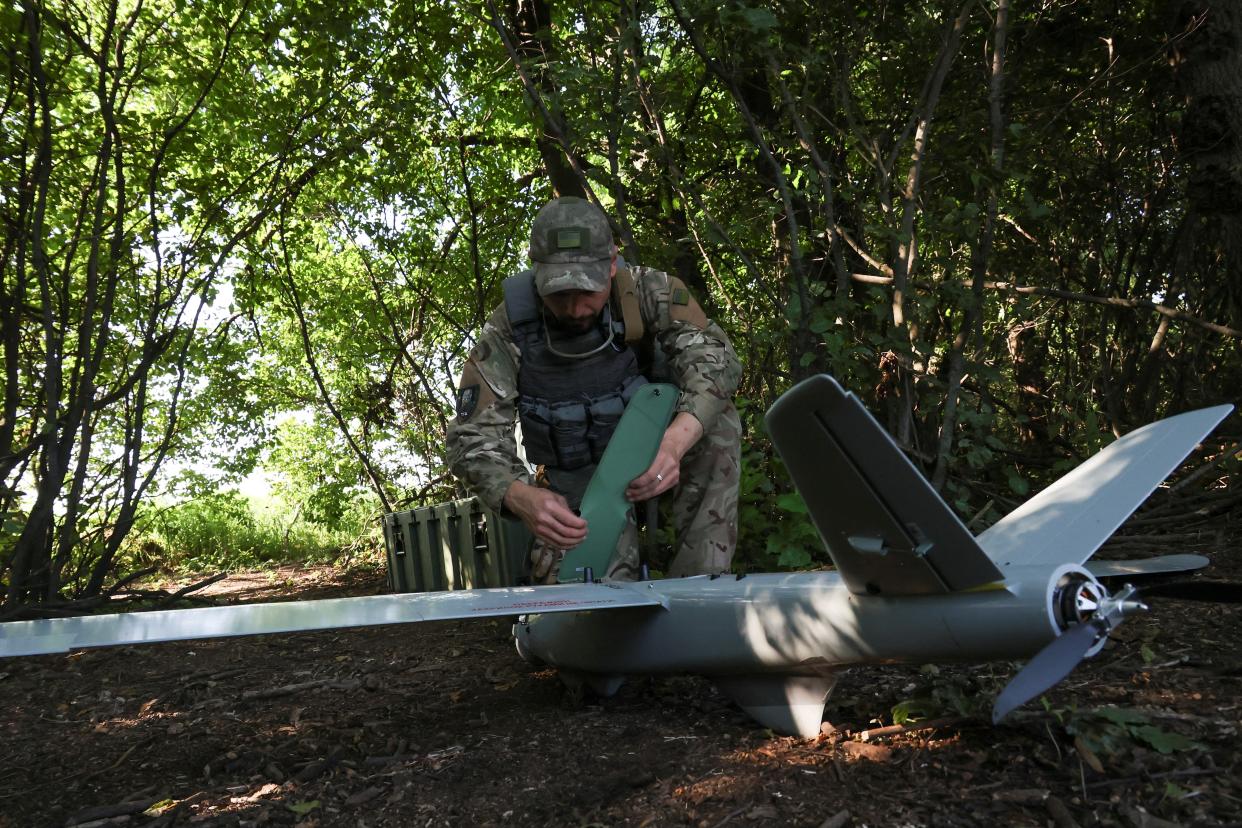A Ukrainian serviceman prepares a reconnaissance unmanned aerial vehicle for flight near a frontline in Donetsk (REUTERS)