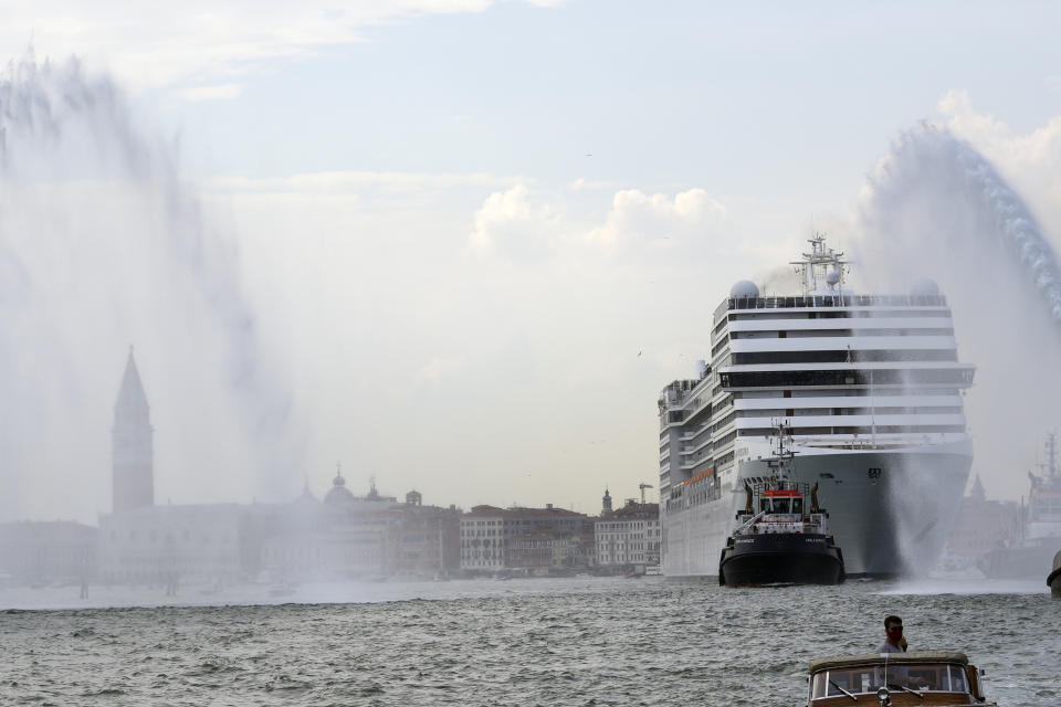 The MSC Orchestra cruise ship leaves Venice, Italy, Saturday, June 5, 2021. The 92,409-ton, 16-deck MSC Orchestra cruise ship, the first cruise ship leaving Venice since the pandemic, departed Saturday amid protests by activists demanding that the enormous ships be permanently rerouted out the fragile lagoon, especially Giudecca Canal through the city's historic center, due to environmental and safety risks. The ship passed two groups of protesters: pro-cruise advocates whose jobs depend on the industry as well as protesters who have been campaigning for years to get cruise ships out of the lagoon. (AP Photo/Antonio Calanni)