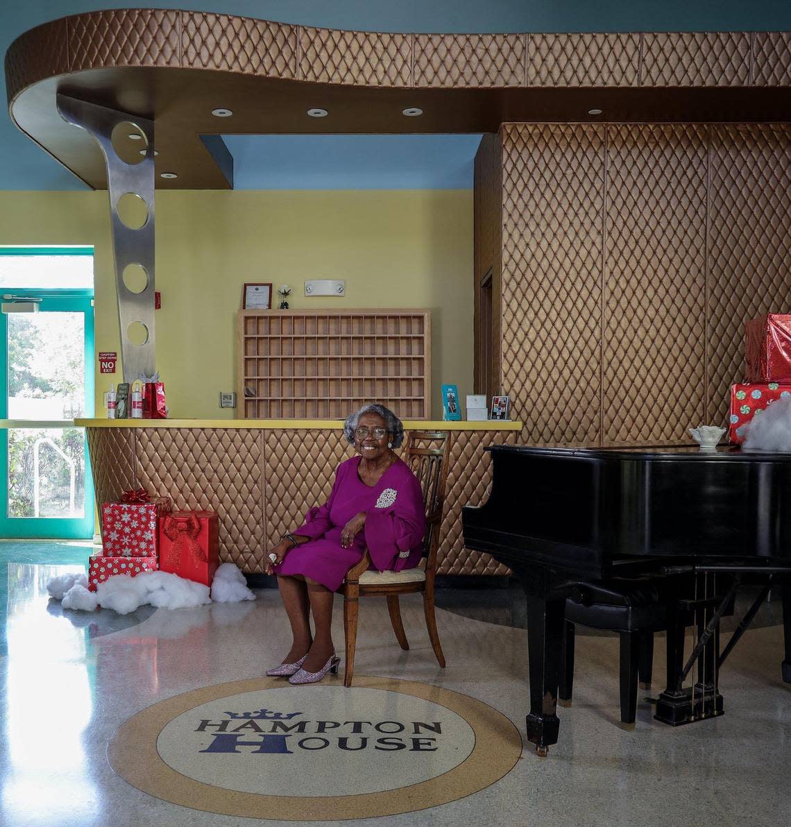 Former director Enid C. Pinkney is photographed in the grand lobby of the Hampton House. Pinkney was instrumental in the preservation of the Hampton House and its renovation. Hampton House plays a role in the 2020 film ‘One Night in Miami,’ the fictional account of one night where Muhammad Ali, Malcolm X, Sam Cooke and Jim Brown gathered to discuss their roles in the civil rights movement and cultural upheaval of the 1960s at a historic segregation-era motel in Miami’s Brownsville neighborhood.