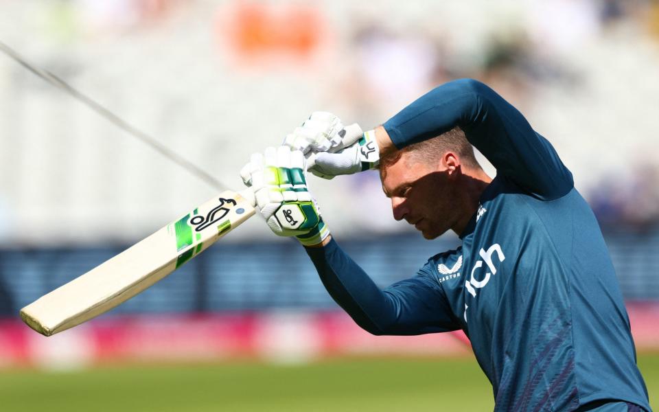 England's Jos Buttler warms up before the match