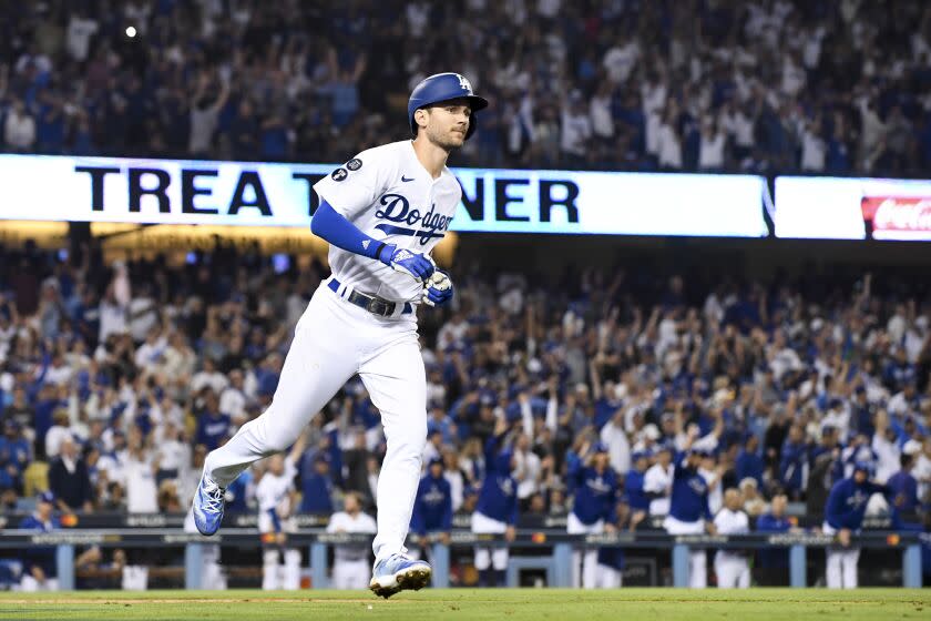 Los Angeles, CA - October 12: Los Angeles Dodgers' Trea Turner rounds the bases after hitting a solo home run.