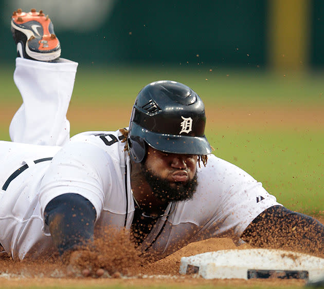 Prince slides in safely with a triple 