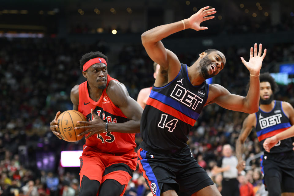 Toronto Raptors forward Pascal Siakam (43) is fouled by Detroit Pistons guard Alec Burks (14) as he drives to the net during the second half of an NBA basketball game, in Toronto, Sunday, Nov. 19, 2023. (Christopher Katsarov/The Canadian Press via AP)