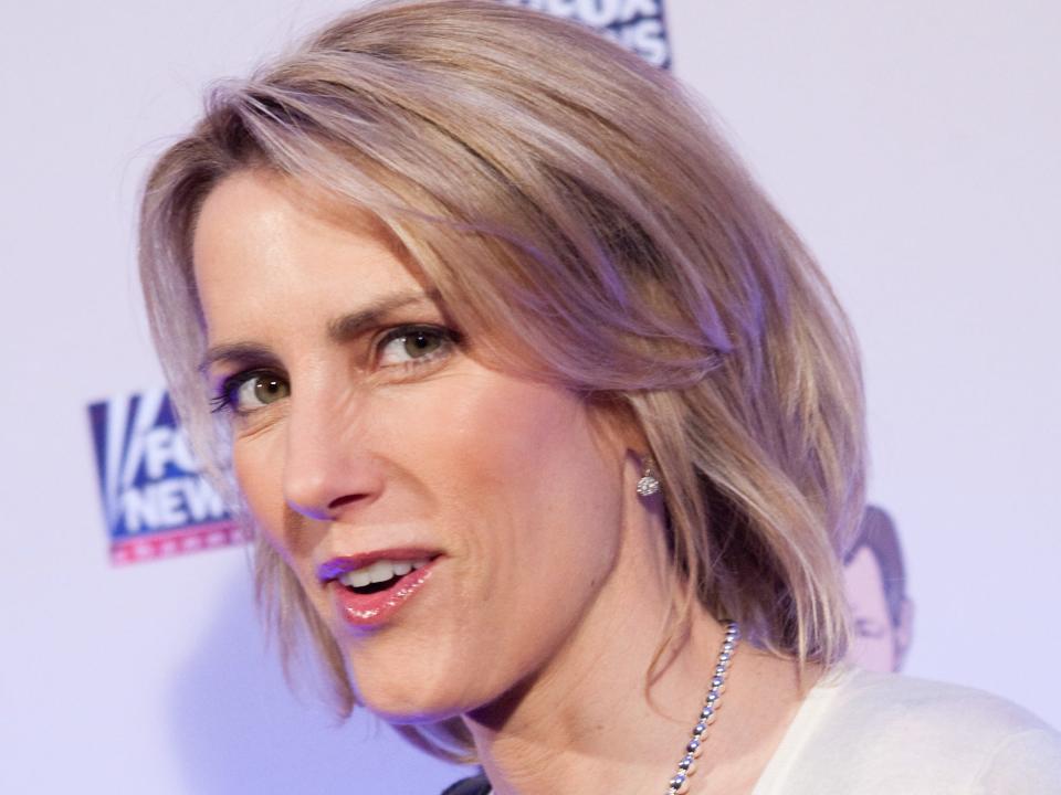 Conservative radio host Laura Ingraham poses on the red carpet upon arrival at a salute to FOX News Channel's Brit Hume on January 8, 2009 in Washington, DC.