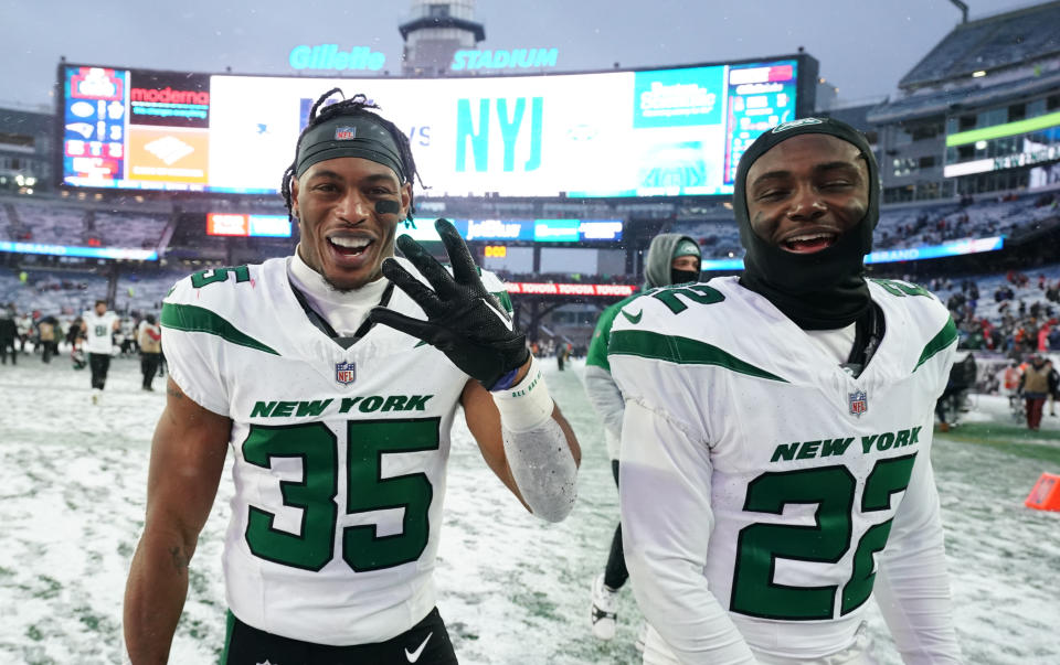 Jan 7, 2024; Foxborough, Massachusetts, USA; New York Jets running back Xazavian Valladay (35) and safety Tony Adams (22) head off the field after defeating the New England Patriots at Gillette Stadium. Mandatory Credit: David Butler II-USA TODAY Sports