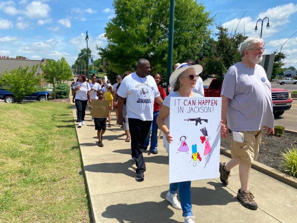 March For Our Lives demonstrators walk through downtown Jackson. Councilman Johnny Dodd can be seen (center).