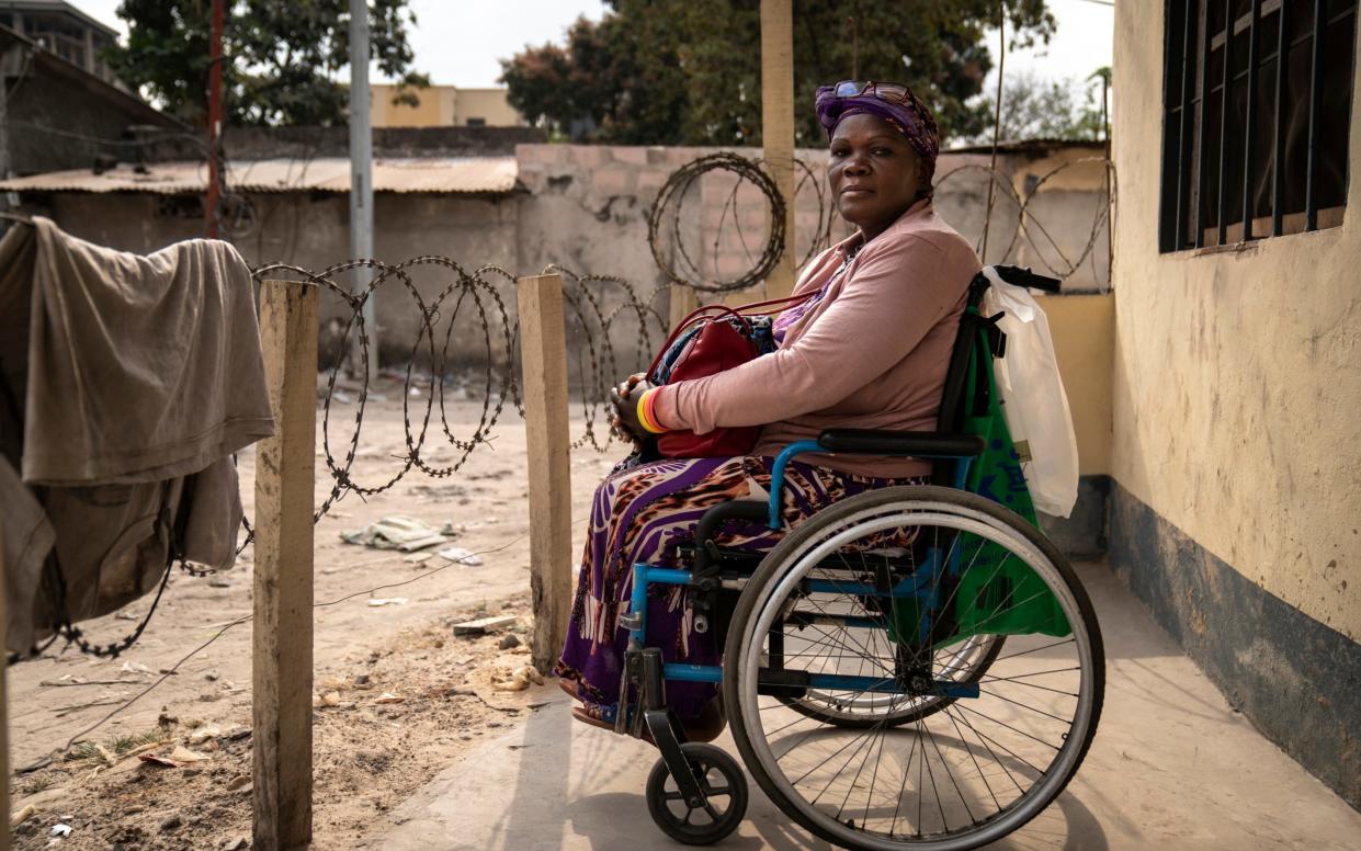 Polio survivor Rose Ndombe must crawl up a flight of stairs every day to reach her first-floor office - Diana Zeyneb Alhindawi/United Nations Foundation