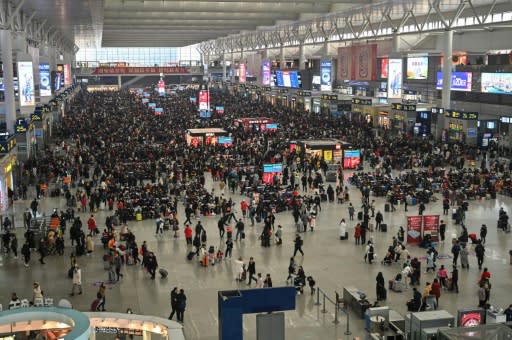 During the annual Lunar New Year holiday, hundreds of millions of Chinese people travel across the country to visit family, including from Hongqiao Railway Station in Shanghai (pictured)