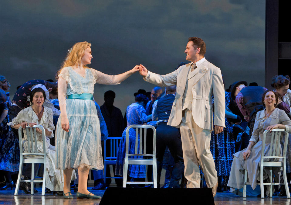 In this March 18, 2013 photo provided by the Metropolitan Opera, Marina Poplavskaya is Valentin and Piotr Beczala appears in the title role during a dress rehearsal of “Faust” at the Metropolitan Opera in New York. (AP Photo/Metropolitan Opera, Cory Weaver)