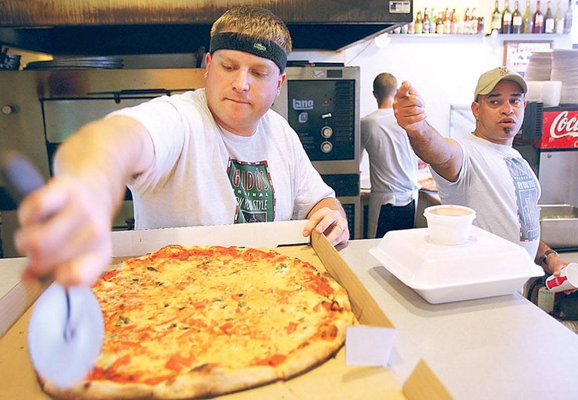 General Manager Evan Marks slices a pie at Guido’s New York Style Pizza in downtown Boise on a busy Monday lunch hour. Guido’s has been around for 15 years, before Boise had numerous skinny, single-slice pizza options.