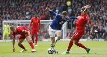 Britain Soccer Football - Liverpool v Everton - Premier League - Anfield - 1/4/17 Everton's Ross Barkley in action with Liverpool's Lucas Leiva (L) and Roberto Firmino Action Images via Reuters / Carl Recine Livepic