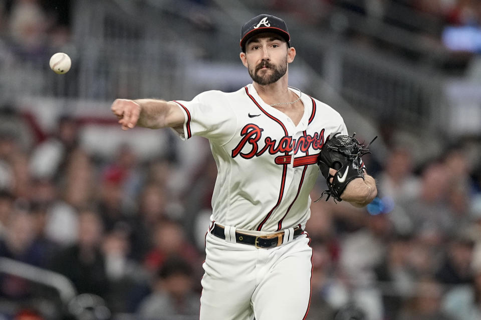 Atlanta Braves starting pitcher Spencer Strider (99) throws the ball to first picking off Philadelphia Phillies shortstop Trea Turner (7) during the sixth inning of Game 1 of a baseball NL Division Series, Saturday, Oct. 7, 2023, in Atlanta. (AP Photo/Brynn Anderson)