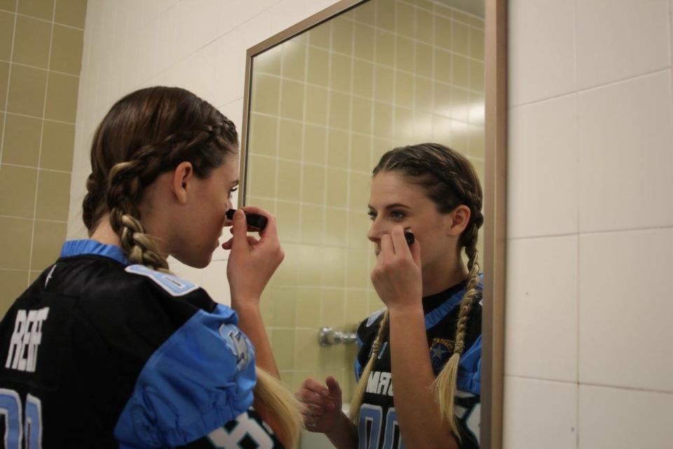 Defensive back Kaitlan Reiff puts on eyeblack before taking the field with the Nevada Storm. (Photo courtesy of Kaitlan Reiff)