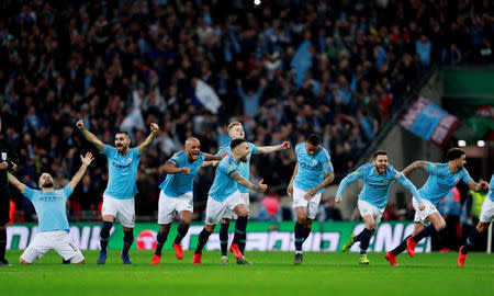 Soccer Football - Carabao Cup Final - Manchester City v Chelsea - Wembley Stadium, London, Britain - February 24, 2019 Manchester City's Bernardo Silva, Vincent Kompany and team mates celebrate after winning the penalty shootout Action Images via Reuters/Andrew Couldridge