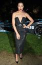 The model dons a black midi Ester Abner dress with slit at the neckline to a private dinner celebrating the premiere of the Formula E documentary <em>And We Go Green</em>.