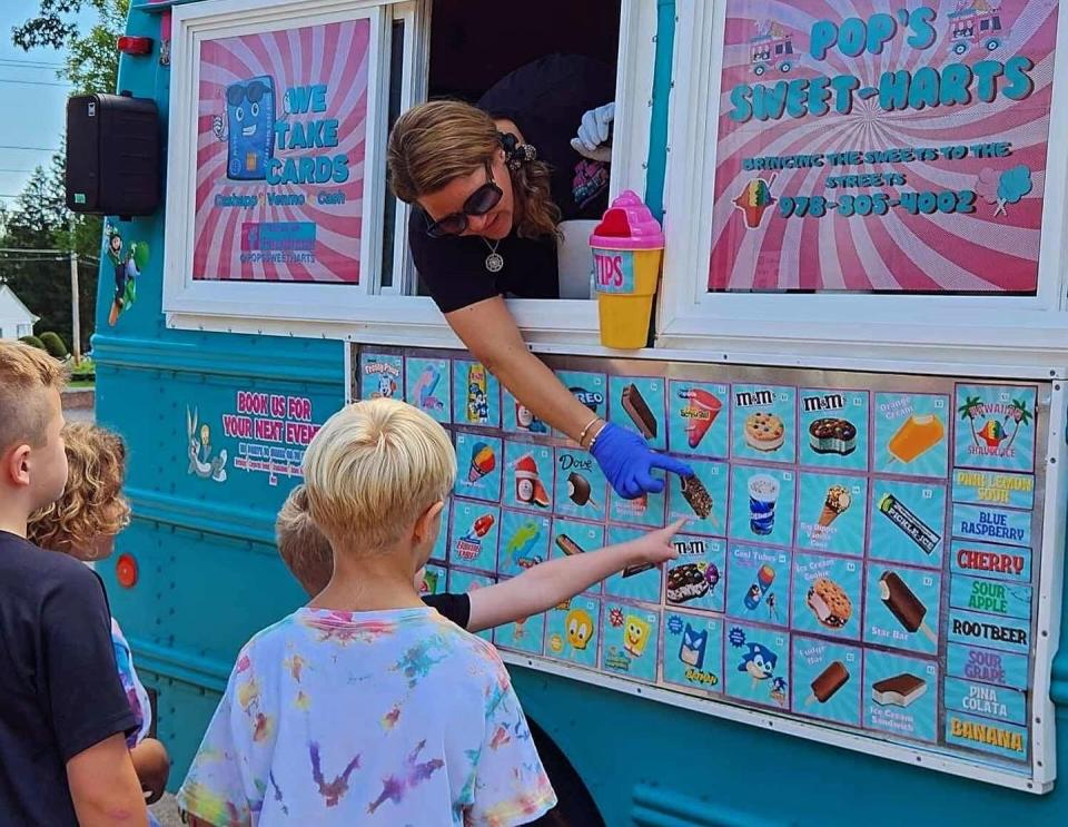 Nancy Tessier, owner of Pop’s Sweet-Harts Ice Cream Trucks, serves customers from one of her two vehicles that will be selling frozen treats throughout Greater Gardner this season.