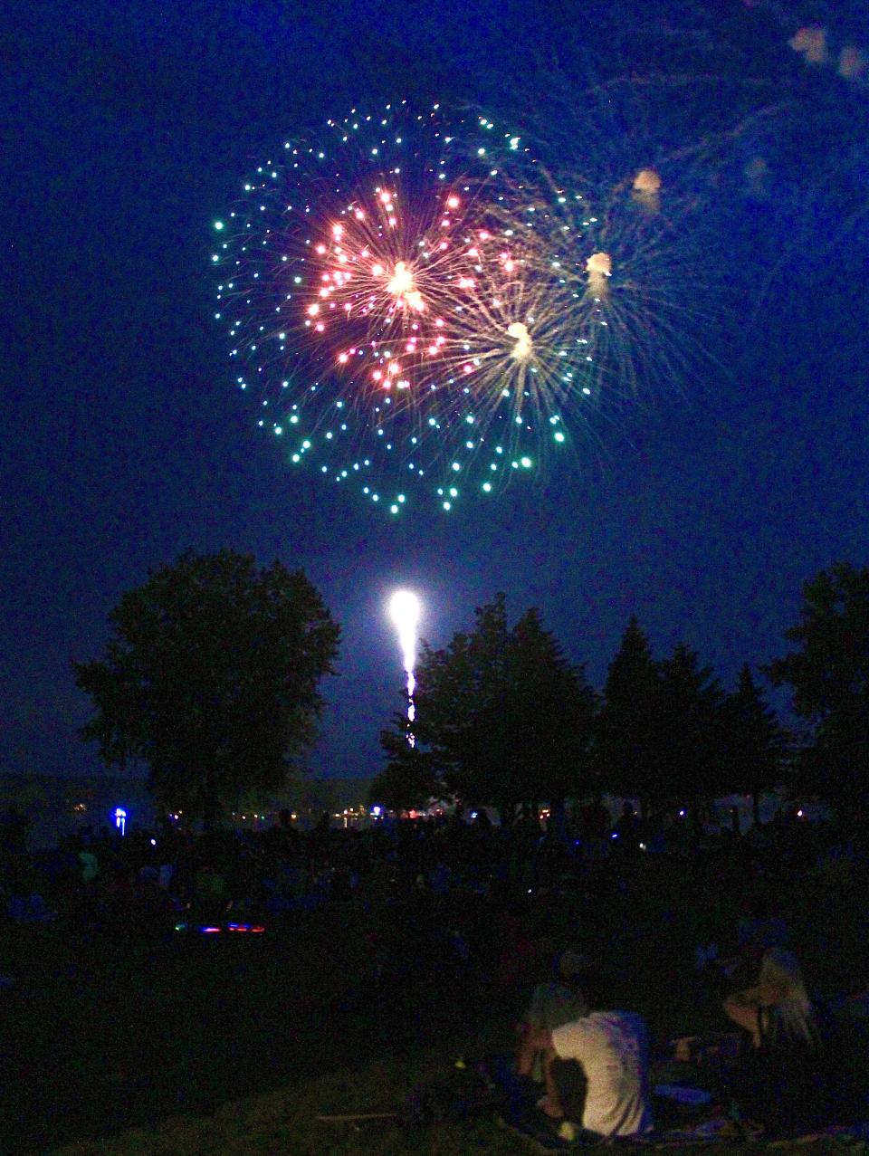 Spectators watch fireworks go up and off over the waters bordering Sunset Park during last year's "Sturgeon Bay Celebrates!" Fourth of July festivities.