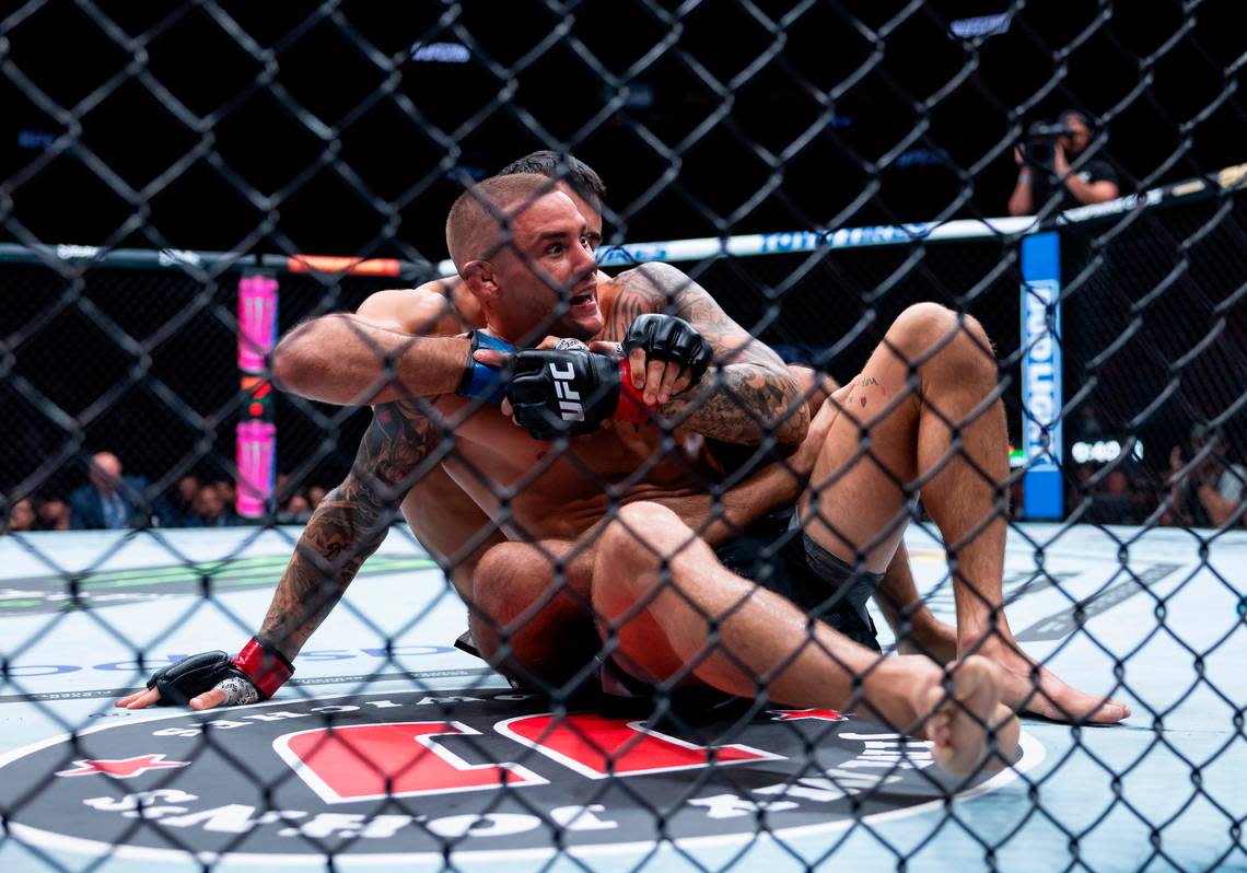 Dustin Poirier of the United States fights against Benoit Saint Denis of France during their lightweight title match during the UFC 299 event at the Kaseya Center on Saturday, March 9, 2024, in downtown Miami, Fla.