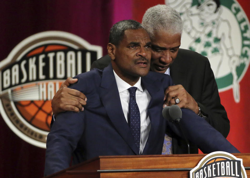 Maurice Cheeks, left, is hugged by Hall of Famer Julius Erving while speaking during induction ceremonies into the Basketball Hall of Fame, Friday, Sept. 7, 2018, in Springfield, Mass. (AP Photo/Elise Amendola)