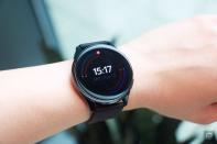 <p>OnePlus Watch review photos. OnePlus Watch on a wrist with display showing the time and outlines of rings in different colors around the face.</p> 