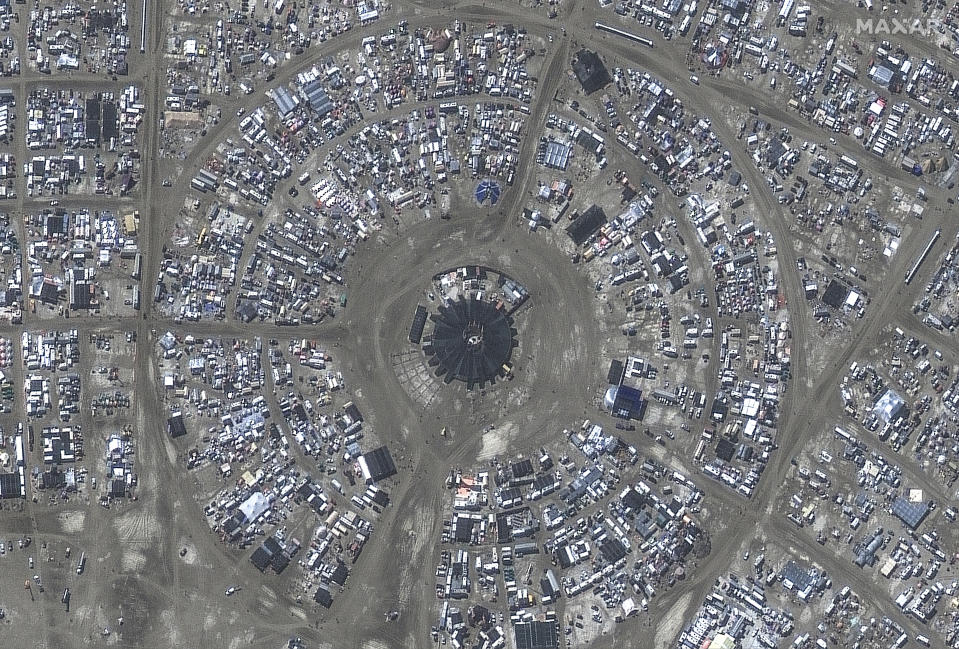 This photo, provided by Maxar Technologies, shows an overview of the center camp at the Burning Man festival on Monday, Sept. 4, 2023, in the Black Rock Desert north of Reno, Nev. Partygoers stranded for days at the counterculture festival by a late summer storm were allowed to start leaving Monday afternoon after muddy roads dried up enough for them to begin their exodus from the northern Nevada desert. (Satellite image ©2023 Maxar Technologies via AP)