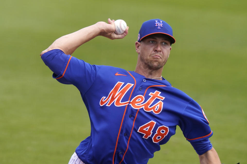 New York Mets starting pitcher Jacob deGrom (48) warms up before a spring training baseball game against the Houston Astros, Tuesday, March 16, 2021, in Port St. Lucie, Fla. (AP Photo/Lynne Sladky)