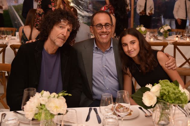 Howard Stern, left, is pictured with Jerry Seinfeld and his daughter, Sascha Seinfeld, at a benefit event on July 29, 2017, in East Hampton, New York.