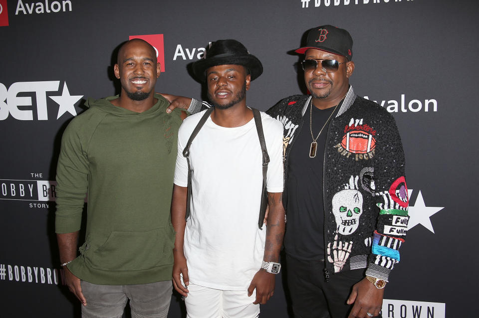 Bobby Brown Jr (centre) with brother Landon (left), and father Bobby Brown (right). (Photo by Jesse Grant/Getty Images)