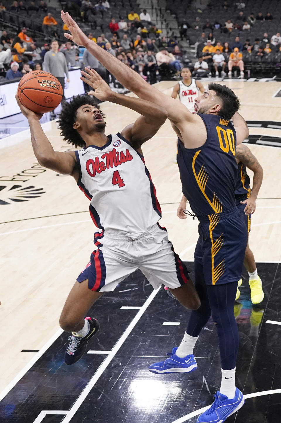 Mississippi forward Jaemyn Brakefield (4) shoots against California forward Fardaws Aimaq (00) during the second half of an NCAA college basketball game in San Antonio, Saturday, Dec. 16, 2023. (AP Photo/Eric Gay)