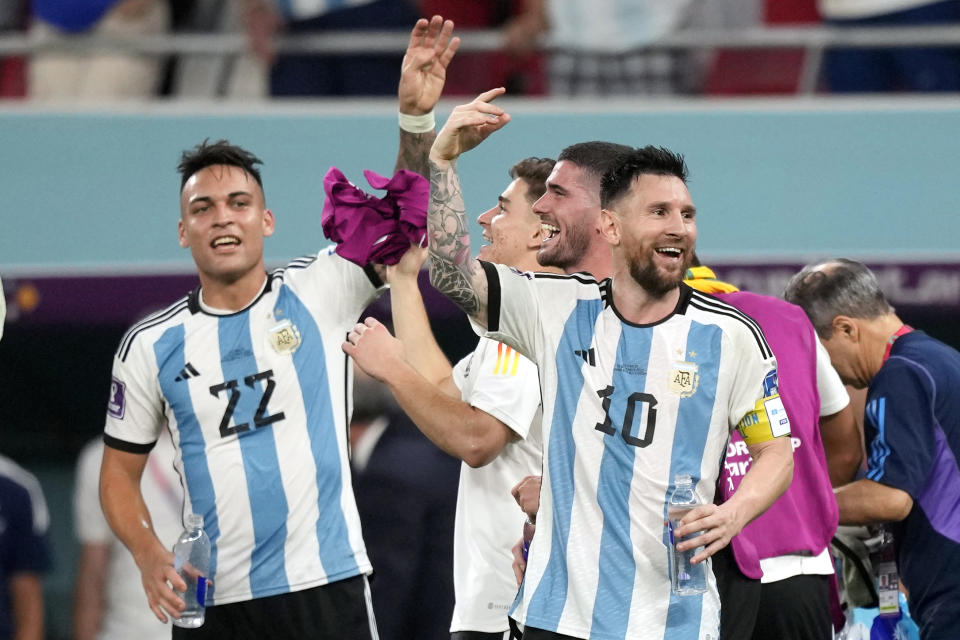 Argentina's Lionel Messi and his teammates celebrate after the World Cup round of 16 soccer match between Argentina and Australia at the Ahmad Bin Ali Stadium in Doha, Qatar, Saturday, Dec. 3, 2022. (AP Photo/Frank Augstein)