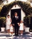 <p>President John F. Kennedy and First Lady Jackie Kennedy pose for the Easter Sunday picture with their two children, John, left and Caroline, right. The photograph was taken after the family attended a private mass at the President's father's oceanfront home in Palm Beach, Florida. </p>