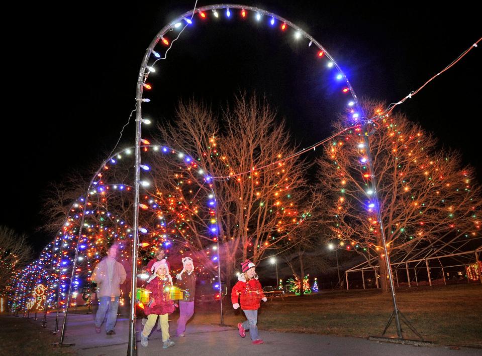 Visitors enjoy the lights as they enter Edaville in 2012.