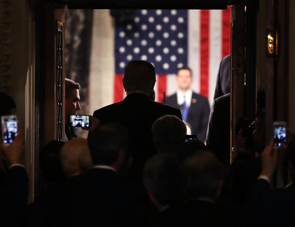 U.S. President Donald Trump stands in the doorway of the House chamber while being introduced to speak before a joint session of Congress on February 28, 2017 in Washington, DC.&nbsp;