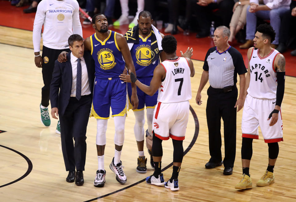 Kyle Lowry of the Toronto Raptors reacts as Kevin Durant #35 of the Golden State Warriors is carried off the court in the first half during Game Five of the 2019 NBA Finals at Scotiabank Arena on June 10, 2019 in Toronto, Canada. NOTE TO USER: User expressly acknowledges and agrees that, by downloading and or using this photograph, User is consenting to the terms and conditions of the Getty Images License Agreement. 