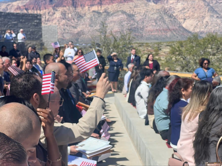 61 people from 20 different countries celebrated U.S. citizenship at Red Rock Canyon Saturday morning. (KLAS/Lauren Negrete)