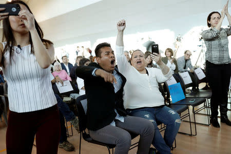 Attendees react during a town hall meeting being held by Thomas Homan, acting director of enforcement for ICE, in Sacramento, California, U.S., March 28, 2017. REUTERS/Stephen Lam