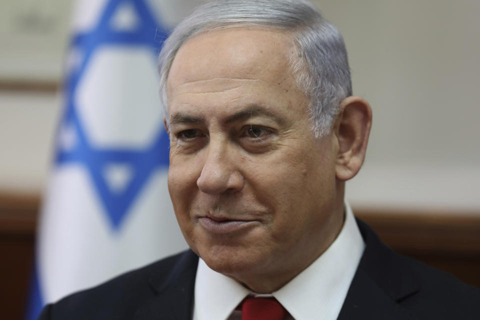 Israeli Prime Minister Benjamin Netanyahu chairs the weekly cabinet meeting at his office in Jerusalem, Sunday, Oct. 27, 2019. Israel's prime minister says he wants a "broad national unity government" amid political deadlock over forming a government following last month's elections. Speaking to his Cabinet, Benjamin Netanyahu said such a coalition is essential for Israel to face what he said were mounting security challenges around the region.(Gali Tibbon/Pool Photo via AP)