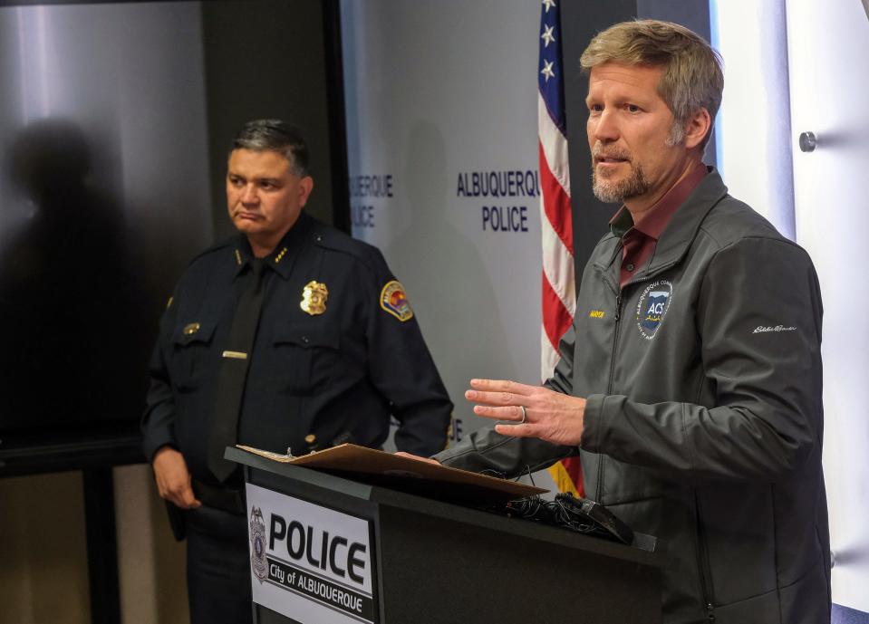 Albuquerque Mayor Tim Keller, right, is joined by Albuquerque Police Chief Harold Medina as they announce they have a suspect in custody who they believe is linked to at least one of the recent shootings at or near the homes or offices of several elected officials, Monday, Jan. 9, 2023, in Albuquerque, N.M.