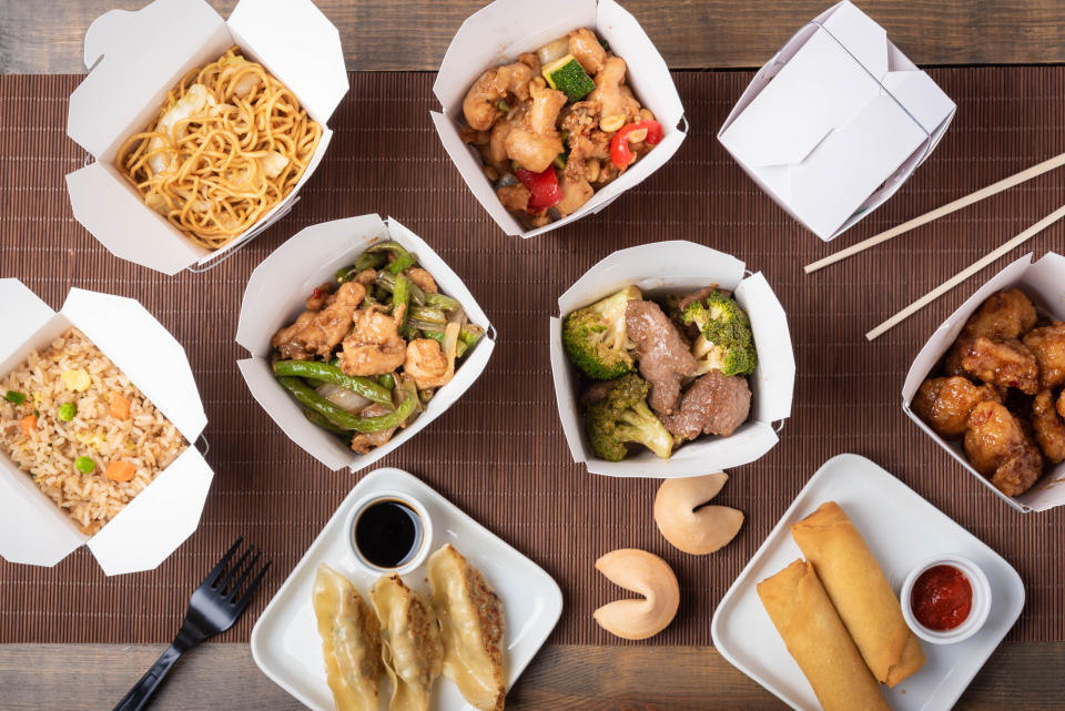 Ordering family-style eliminates the pressure to eat an entire container of one takeout dish by yourself. (Photo: ahirao_photo via Getty Images)