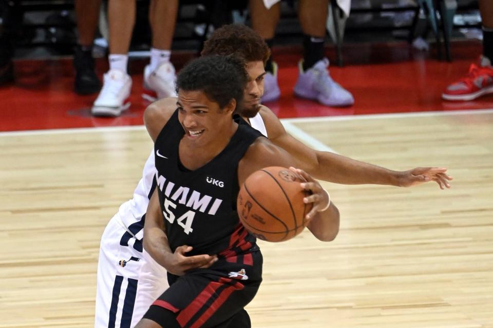 The Miami Heat's Dru Smith (54) tries to move past Utah's MaCio Teague in an NBA summer league game on  Aug. 13 in Las Vegas.