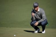 Charley Hoffman of the U.S. looks over his putt on the second green in second round play during the 2017 Masters golf tournament at Augusta National Golf Club in Augusta, Georgia, U.S., April 7, 2017. REUTERS/Lucy Nicholson